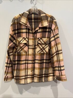 Women’s plaid flannel shacket, a button-down shirt jacket perfect for layering.
